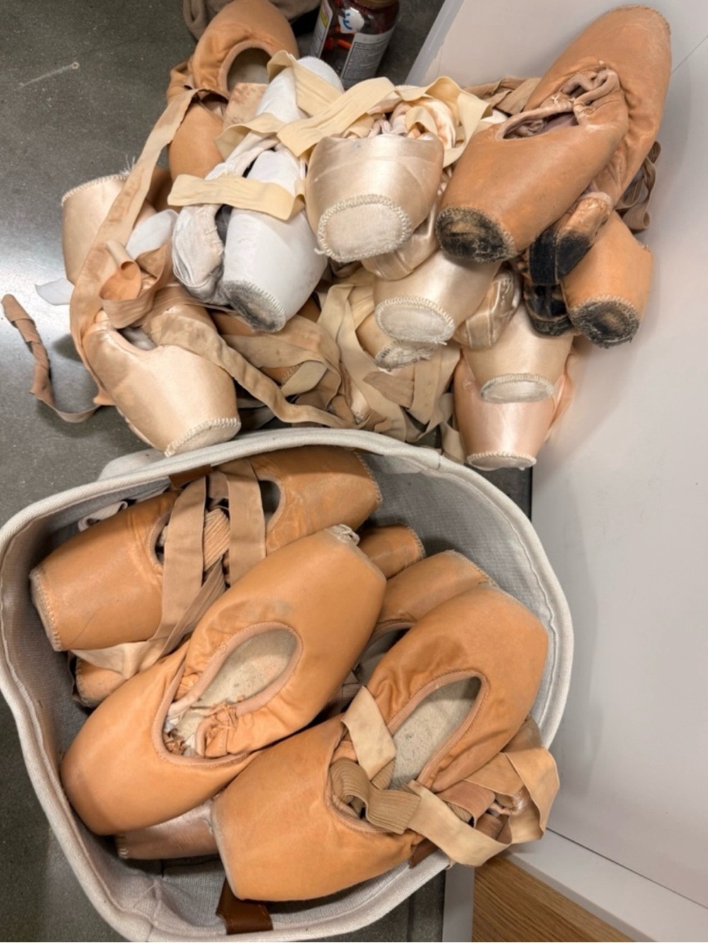 Five pairs of used pointe shoes